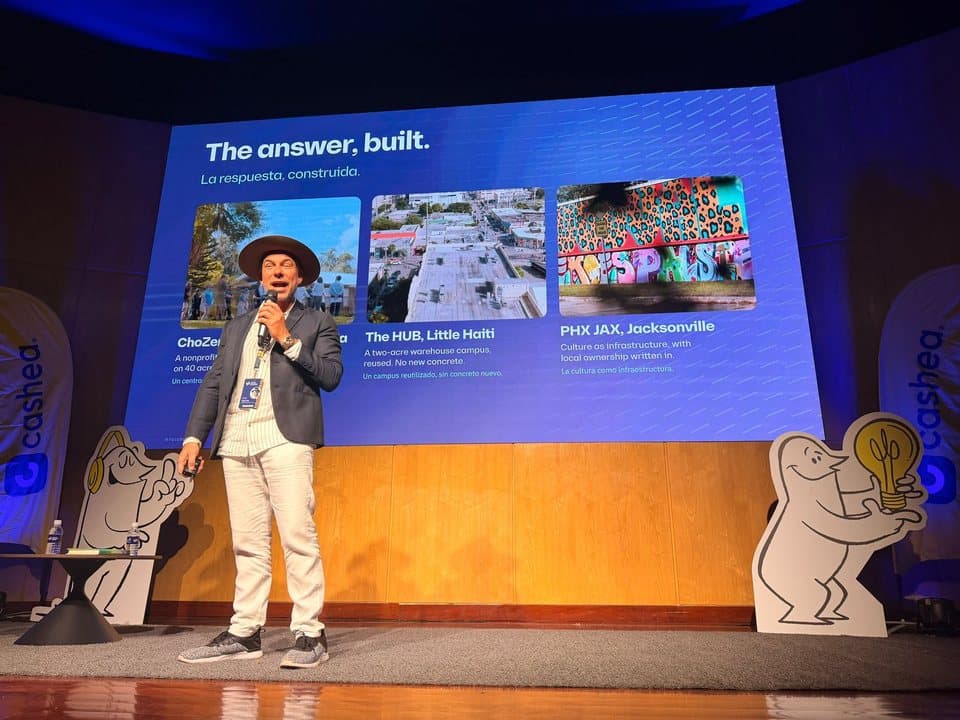 Tony Cho on stage at Startup Venezuela, presenting the places he built